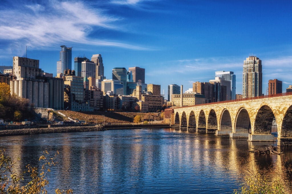 Downtown Minneapolis skyline and the Stone Arch Bridge over the Mississippi River